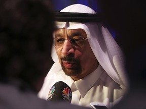 Saudi Energy Minister Khalid al-Falih speaks to journalists in Dubai, United Arab Emirates, Tuesday, Nov. 28, 2017. The energy ministers of Saudi Arabia and the United Arab Emirates both said Tuesday that those wanting to know whether OPEC will extend its production cuts will have to wait until the cartel's upcoming Vienna meeting on Thursday. (AP Photo/Jon Gambrell)