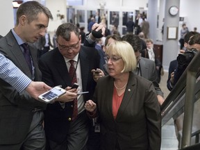 In this Oct. 18, 2017, file photo, Sen. Patty Murray, D-Wash., the ranking member of the Senate Health, Education, Labor, and Pensions Committee, talks to reporters on Capitol Hill in Washington. Millions would forgo coverage if Congress repeals the unpopular requirement that Americans get health insurance, gambling with their own wellbeing and boosting premiums for others. Just as important, the drive by GOP senators to undo "Obamacare's" coverage requirement fits in with Trump administration efforts to write regulations allowing for plans with limited benefits and lower premiums.  (AP Photo/Carolyn Kaster)