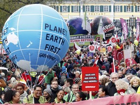 Protestors demand the implementation of the climate change convention in Bonn, Germany.