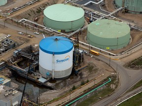 Oil storage tanks stand at a Suncor Energy oilsands operation near Fort McMurray, Alberta. It took three years to engineer a deal that turned Fort McKay and Mikisew Cree First Nations into owners of a 49 per cent stake in a Suncor storage facility.