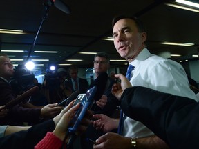 Finance Minister Bill Morneau speaks to members of the media as he arrives for meetings with his provincial and territorial counterparts on Parliament Hill in Ottawa on Monday, Dec. 11, 2017.