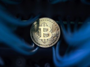 Bitcoin's volatility is adding to an ongoing debate about how to value the digital coin which has surged about 1,600 per cent this year.