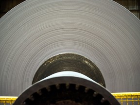 A finished roll of newsprint paper, weighing close to four tons, sits on the production line at the Resolute Forest Products mill in Thunder Bay, Ontario.