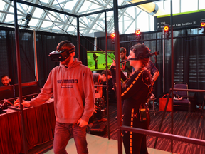 Attendees trying a game demonstration at the Montreal International Game Summit.