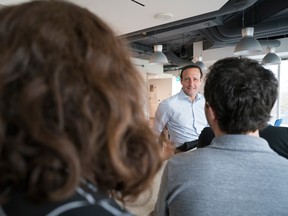 David Ossip speaks with staff in the Ceridian offices in Toronto.