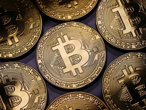 Cboe Global Markets Inc., one of the world's biggest regulated exchanges, began offering futures contracts at 6 p.m. in New York, capping a wild year for the digital currency.