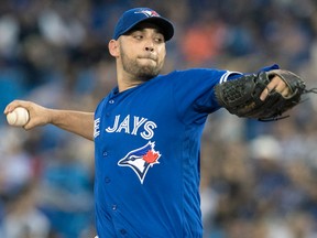 Toronto Blue Jays starting pitcher Marco Estrada throws against the New York Yankees during the first inning of their American League MLB baseball game in Toronto on Sept. 22.