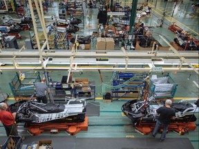 Workers at the manufacturing line for the BRP Tundra snowmobile at the BRP assembly plant in Valcourt, Quebec on Tuesday, July 4, 2017.