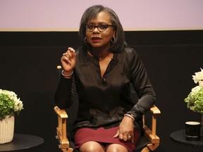 FILE - In this Dec. 8, 2017 file photo, Anita Hill speaks at a discussion about sexual harassment and how to create lasting change from the scandal roiling Hollywood at United Talent Agency in Beverly Hills, Calif. Hollywood executives and other major players in entertainment have established a commission to be chaired by Hill that intends to combat sexual misconduct and gender inequities across the industry. A statement Friday, Dec. 15, 2017, announced the founding of the Commission on Sexual Harassment and Advancing Equality in the Workplace.