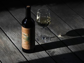 This Friday, Dec. 22, 2017, photo shows a bottle of Rebel Coast Winery's cannabis-infused wine in Los Angeles. As the world's largest legal recreational marijuana market takes off in California, the trendsetting state is set to ignite the cannabis-culinary scene. Rebel Coast Winery's THC-infused sauvignon blanc is made from Sonoma County grapes, but the alcohol is removed in compliance with regulations that prohibit mixing pot with alcohol.