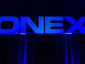 The Onex Corporation logo is displayed at the company's annual general meeting in Toronto on Thursday, May 10, 2012. The U.K.-based company behind the Regus brand of rental office space says it has received a potential takeover offer from Toronto-based Brookfield Asset Management Inc. and Onex Corp.