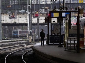 A man stands on a platform at the Gare Saint Lazare train station, in Paris, Thursday, June 2, 2016. Bombardier Inc.â€™s rail division has received an order worth about US$444 million for 32 double-deck transets from Franceâ€™s national railway company. The commuter trains will be used on three lines connecting the Centre-Val de Loire region and Paris.