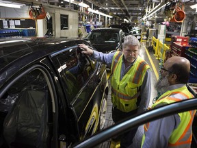 Sales fell in eight of the 21 industries tracked by Statistics Canada, with most of the decline attributed to the transportation equipment sector that includes motor vehicles. Ford Edge vehicles stand on a production line at the Ford Assembly Plant in Oakville, Ont., on Thursday, February 26, 2015.