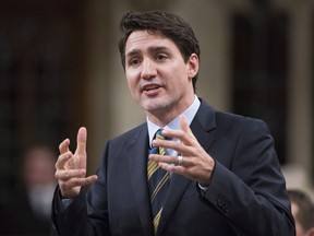 Prime Minister Justin Trudeau responds to a question during Question Period in the House of Commons Wednesday November 29, 2017 in Ottawa. Government officials say Prime Minister Justin Trudeau has no plans to launch free trade talks when he visits China next week THE CANADIAN PRESS/Adrian Wyld