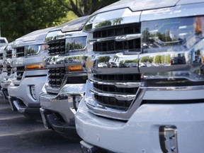 In this Wednesday, April 26, 2017, photo, trucks are lined up in the lot at a dealership in Richmond, Va.