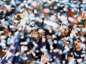 The Toronto Argonauts celebrate as they hoist the Grey Cup after defeating the Calgary Stampeders in the 105th Grey Cup, Sunday, November 26, 2017 in Ottawa. Maple Leaf Sports & Entertainment has struck a deal to buy the CFL's Toronto Argonauts.THE CANADIAN PRESS/Sean Kilpatrick