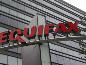 Signage at the corporate headquarters of Equifax Inc. in Atlanta on July 21, 2012. Equifax Canada has revised the number of Canadians caught up in a massive data breach earlier this year, saying an investigation has found that more than 19,000 were affected.