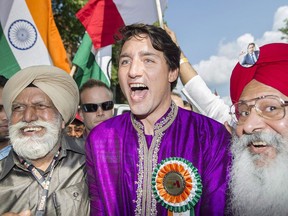 Prime Minister Justin Trudeau greets members of the Indian community during the annual India day parade in Montreal, Sunday, August 20, 2017. An Indian news outlet is reporting that Prime Minister Justin Trudeau will visit India in February, and may pay a visit to its Punjab region's famed Golden Temple.