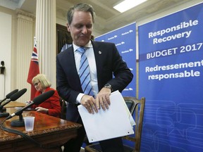 Manitoba Finance Minister Cameron Friesen leaves after speaking to media at a press conference at the Manitoba Legislature in Winnipeg on April 11, 2017. Manitoba's finance minister says he and his counterparts will take another look at changes to the Canada Pension Plan amid concerns that low-income workers and women are being shortchanged by the framework agreed to last year. Changes agreed to last year will increase employee premiums and retirement benefits, but do not include provisions that many women use to boost the value of their retirement payments.