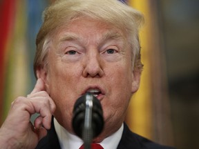 President Donald Trump speaks before signing the National Defense Authorization Act for Fiscal Year 2018, in the Roosevelt Room of the White House, Tuesday, Dec. 12, 2017, in Washington.