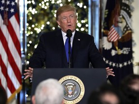President Donald Trump speaks on tax reform in the Grand Foyer of the White House, Wednesday, Dec. 13, 2017, in Washington.