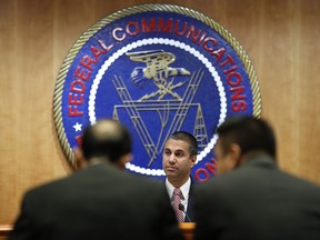 Federal Communications Commission (FCC) Chairman Ajit Pai takes his seat for an FCC meeting where they will vote on net neutrality, Thursday, Dec. 14, 2017, in Washington.