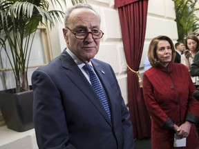 Senate Minority Leader Chuck Schumer, D-N.Y., and House Minority Leader Nancy Pelosi, D-Calif., right, speak to reporters just before House and Senate tax bill conferees meet to work on the sweeping overhaul of the nation's tax laws, on Capitol Hill in Washington, Wednesday, Dec. 13, 2017. Democrats are objecting to the bill and are asking that a final vote be delayed until Senator-elect Doug Jones of Alabama is seated.
