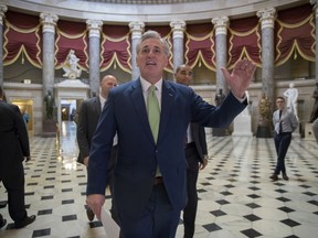 House Majority Leader Kevin McCarthy, R-Calif., walks through Statuary Hall for final passage of the Republican tax reform bill, at the Capitol in Washington, Tuesday, Dec. 19, 2017. Republicans muscled the most sweeping rewrite of the nation's tax laws in more than three decades through the House. In a last-minute glitch, however, Democrats said three provisions in the bill, including one that would allow parents to use college savings accounts for home-schooling expenses for young children, violate Senate budget rules. McCarthy said the House would vote on the package again on Wednesday.