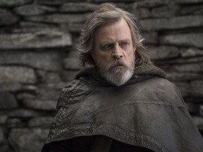 FILE - This file image released by Lucasfilm shows Mark Hamill as Luke Skywalker in "Star Wars: The Last Jedi." On the last day of the calendar year, "Star Wars: The Last Jedi" has surpassed "Beauty and the Beast" as the top grossing film in North America in 2017.