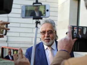 F1 Force India team boss Vijay Mallya arrives at Westminster Magistrates Court in London, Thursday, Dec. 14, 2017. Mallya, the United Breweries Group chairman and co-owner of the Force India F1 team is wanted in India to face fraud allegations. He was arrested in April by the Metropolitan Police's extradition unit on behalf of authorities in India.