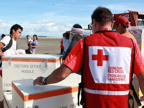 Canadian Red Cross staff supervise the loading of their supplies for typhoon survivors in the Philippines.