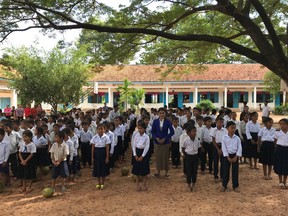 Children assemble outside of the school that Michael Waring started in Cambodia.