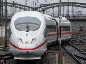 A special train of the Deutsche Bahn (DB) railway company departs towards Berlin at the central station in Munich, Germany, Friday, Dece. 8 2017. The Deutsche Bahn railway company celebrates the opening of the new fast railway track connection between Munich and Berlin on Friday.