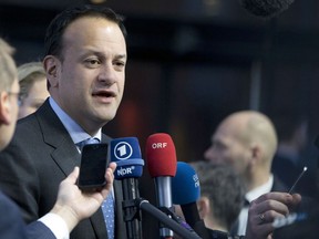 FILE - This is a Friday, Nov. 17, 2017.  file photo of Irish Prime Minister Leo Varadkar, as he  speaks with the press as he arrives for an EU summit in Goteborg, Sweden. Ireland's governing party and main opposition are on Tuesday Nov. 28, 2017, holding last-minute talks to avoid the government collapsing just as it faces a crunch time in Brexit negotiations. Irish lawmakers are due to vote on a no-confidence motion in the deputy prime minister filed by opposition party Fianna Fail.(AP Photo/File, Virginia Mayo)