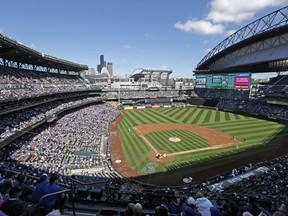 FILE - In this Sept. 21, 2016, file photo, the Seattle Mariners play the Toronto Blue Jays in a baseball game at Safeco Field in Seattle. Big league teams in Texas, Florida, Nevada and Washington state may have become more attractive destinations for free agents following the enactment of tax law changes. The new law that takes effect next year caps deductions for state and local taxes at $10,000 for married couples filing jointly. That has a huge impact for athletes with seven- and eight-figure salaries.