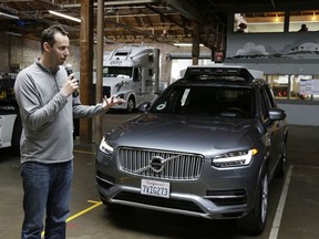 FILE - In this photo taken Tuesday, Dec. 13, 2016, file photo, Anthony Levandowski, then-head of Uber's self-driving program, speaks about their driverless car in San Francisco. A recent letter from the U.S. Attorney's office confirms the Justice Department has opened a criminal investigation connected to allegations that Levandowski, a former Uber executive, stole self-driving car technology from a Google spin-off to help the ride-hailing service build robotic vehicles.