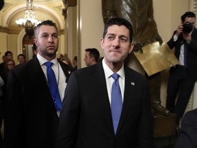 House Speaker Paul Ryan of Wis., center, leaves the House Chamber after voting on the Republican tax bill, Tuesday, Dec. 19, 2017, on Capitol Hill in Washington. Republicans muscled the most sweeping rewrite of the nation's tax laws in more than three decades through the House.