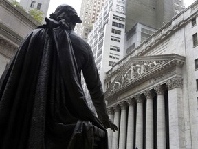 FILE - In this Oct. 2, 2014, file photo, the statue of George Washington on the steps of Federal Hall faces the facade of the New York Stock Exchange. Stocks are opening broadly higher on Wall Street, Wednesday, Dec. 20, 2017, led by gains in banks and industrial companies.