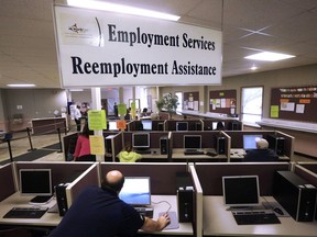 FILE - This Thursday, Sept. 29, 2016, file photo, shows the Illinois Department of Employment Security office in Springfield, Ill. On Thursday, Dec. 28, 2017, the Labor Department reports on the number of people who applied for unemployment benefits the week before.