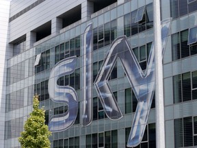 FILE - This Friday, July 25, 2014, file photo shows a view of the headquarters of the Italian Sky television broadcaster in Milan, Italy. Disney announced Thursday, Dec. 14, 2017, that it is buying a large part of Fox. Under the deal, Disney will get at least a 39 percent stake in European satellite-TV and broadcaster Sky. Fox is hoping to acquire the remainder of Sky before the deal closes, giving Disney full control.