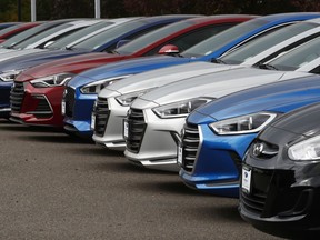 In this Friday, Oct. 6, 2017, photo, a line of 2018 Accents, Elantras and Sonatas sit at a Hyundai dealership in the south Denver suburb of Littleton, Colo. On Friday, Dec. 1, 2017, automakers report U.S. sales of new vehicles in November. (AP Photo/David Zalubowski)