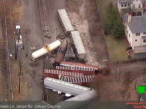 In this image taken from video and provided by WABC, a group of freight cars tangle up along the tracks after derailing in Union, N.J., Friday, Dec. 8, 2017. A Conrail spokesman tells NJ.com the CSX Transportation train was on its way to Selkirk, N.Y., when it derailed at about 1:30 p.m. Union police say no one was injured. (WABC via AP)
