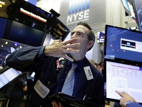 Trader Gregory Rowe works on the floor of the New York Stock Exchange, Wednesday, Dec. 6, 2017. U.S. stocks held steady in Wednesday morning trading, following sharp drops for markets around the world. Coming off its first three-day losing streak since the summer, the Standard & Poor's 500 index flipped between small gains and losses in the first half hour of trading.