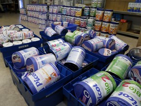 FILE - This Monday, Dec.11, 2017 file picture shows removed baby milk boxes pictured in a drugstore, in Anglet, southwestern France. A tainted baby milk scandal affecting some 30 countries is growing, as French dairy giant Lactalis recalled millions more products globally because of salmonella contamination.