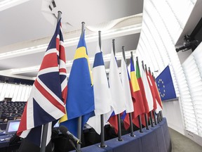The British flag and others flags from EU countries are pictured at the European Parliament in Strasbourg, eastern France, Wednesday, Dec.13, 2017. European Union chief Brexit negotiator Michel Barnier said Wednesday there will be "no turning back" for Britain on commitments made during an initial divorce deal between the two, after his U.K. counterpart insisted it was merely a "statement of intent."