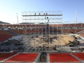 FILE - In this Oct. 30, 2017, file photo, the Pyeongchang Olympic Stadium is still under construction in Pyeongchang, South Korea. As officials prepare for the winter games in and around the small mountain town of Pyeongchang, there are lingering worries over the huge financial burden facing one of the nation's poorest regions. Local officials hope that the Games will provide a badly needed economic boost by marking the area as a world-class tourist destination.