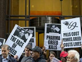 Activists hold signs with a picture of Martin Shkreli, the former Turing Pharmaceuticals CEO, during a protest in New York in 2015.