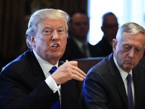 President Donald Trump with Secretary of Defense Jim Mattis, right, speaks during a cabinet meeting in the Cabinet Meeting Room of the White House in Washington, Wednesday, Dec. 6, 2017.