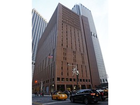 In this Dec. 4, 2017, photo, 4 New York Plaza, where American Media Inc., has its headquarters in New York City. The top editor for the National Enquirer, Us Weekly and other major gossip publications openly described his sexual partners in the newsroom, discussed female employees' sex lives and forced women to watch or listen to pornographic material, former employees told The Associated Press. The behavior by Dylan Howard, currently the chief content officer of American Media Inc., occurred while he was running the company's Los Angeles office, according to men and women who worked there.