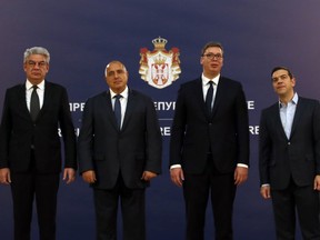 Serbian President Aleksandar Vucic, second from right pose with Romanian Prime Minister Mihai Tudose, left, Bulgarian Prime Minister Boyko Borisov, second from left, and Greece's Prime Minister Alexis Tsipras, right, prior talks in Belgrade, Serbia, Saturday, Dec. 9, 2017. Leaders of Greece, Bulgaria and Romania have pledged support for Serbia's bid to join the European Union, saying it would boost stability in the volatile Balkans.